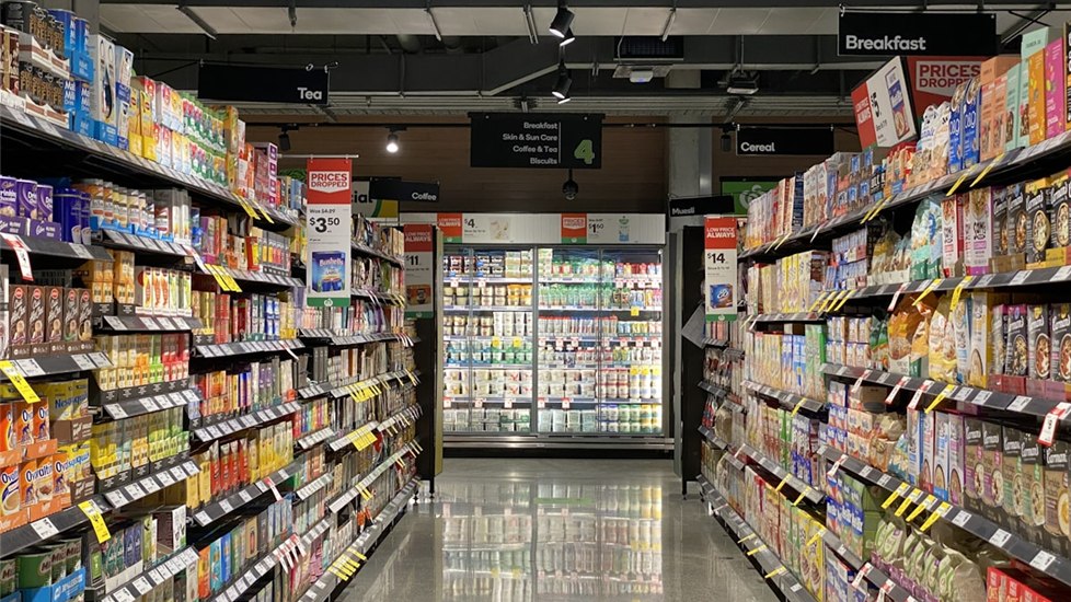 Grocery store aisle where shoppers can find specialty olive oils and Colorado local products